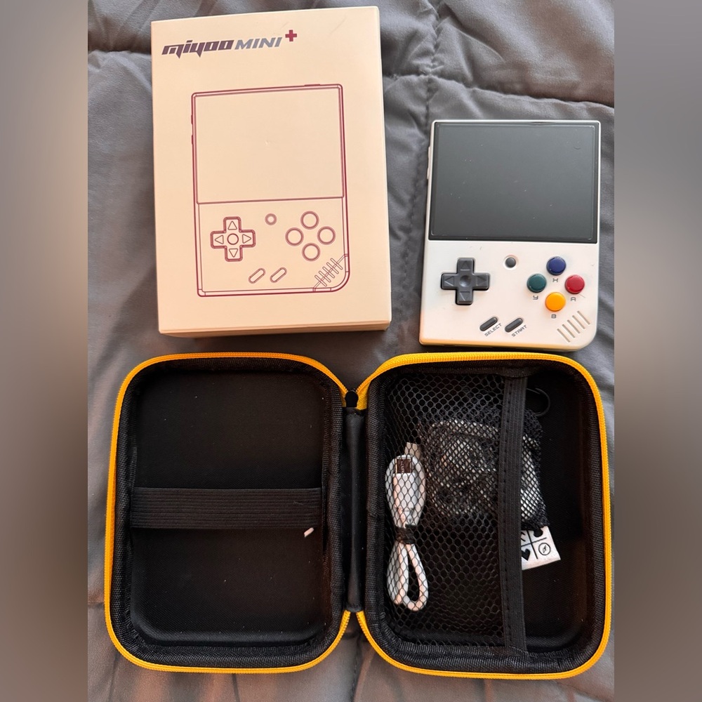 Motion Mini White and Black Handheld Gaming Console with Retro Design